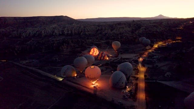 Hot Air Balloons Preparing for Dawn Flight