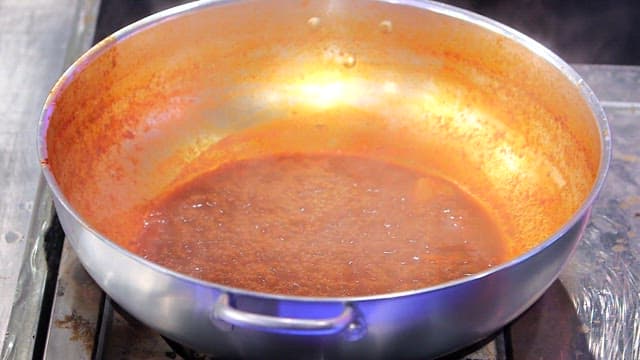 Spicy sauce simmering in a pot