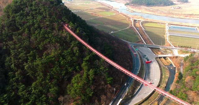 Aerial View of the Red Bridge Connecting Mountains