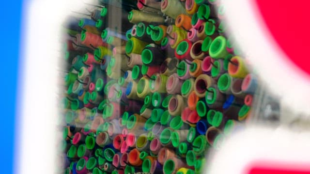 Colorful sewing threads on display in a fabric store