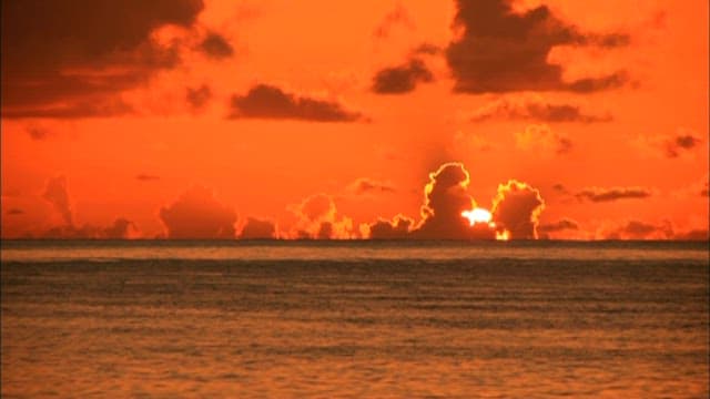 Sunset Over the Ocean with Dramatic Clouds