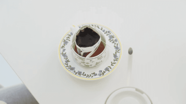 Making drip coffee at a white table