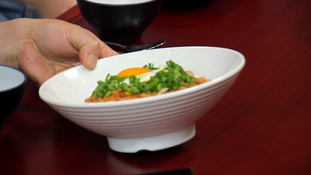 Delicious bean sprout rice bowl topped with a fried egg