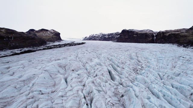 Vast glacier stretching between mountains