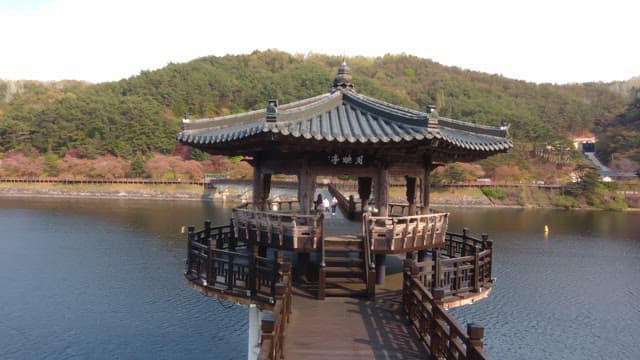 Traditional pavilion over a serene river