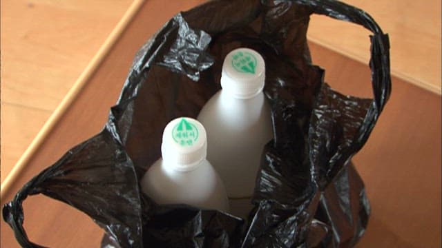 Close-Up of Bottle Caps Inside a Black Bag