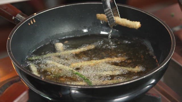 Preparing Fried Asparagus in a Kitchen