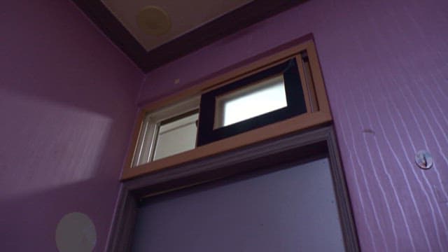 Small High Window in a Purple Wall
