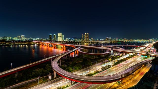 Illuminated Night View of Busy City Highway