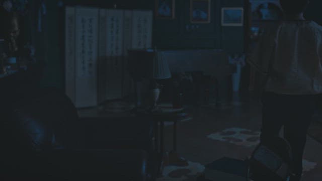 Man walking in a dark room and a drawing of mushroom