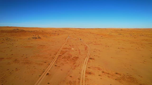 Vehicle Crossing the Vast Desert