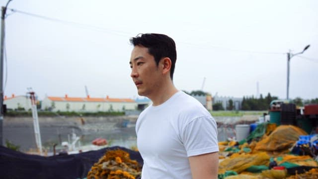 Man walking along the dockside