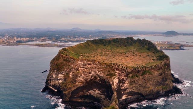 Volcanic island with a crater and ocean
