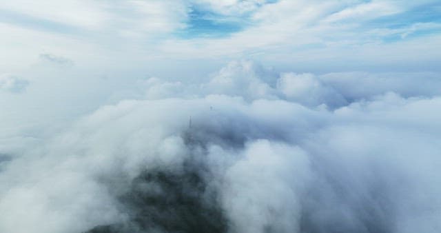 Serene View Above Clouds with Antennas of Transmission Tower