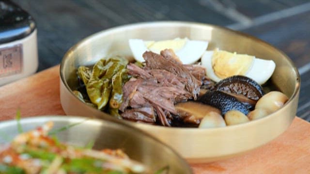 Beef in Soy Sauce and Fragrant Chive Salad on the Table