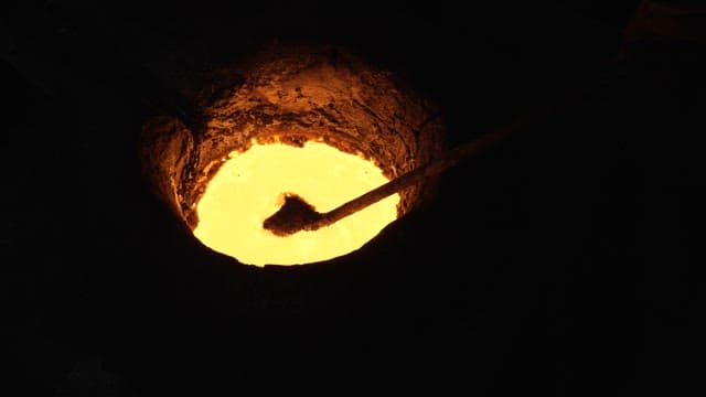 Molten metal being stirred in a furnace