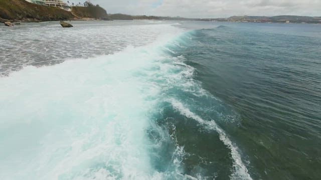 Waves crashing on a vast beach