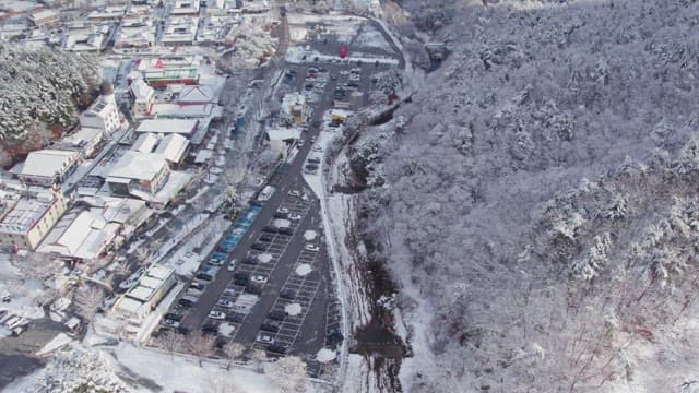 Large parking lot in a snowy forest