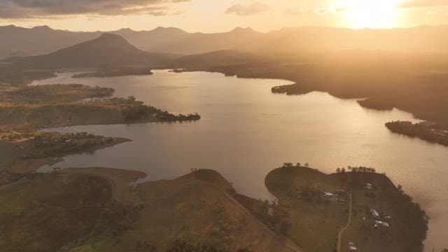 Serene Mogerah lake surrounded by mountains at sunset