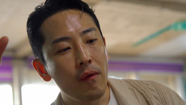 Man smiling and drinking alcohol