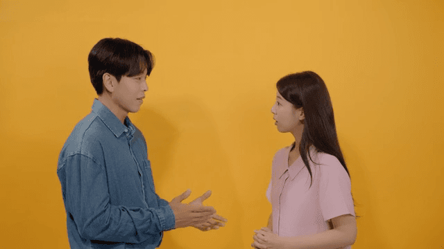 Man and a woman facing each other and talking intimately