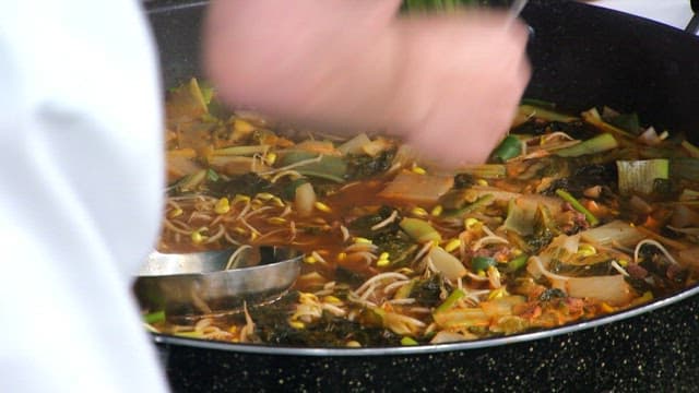 Cheongyang peppers add spiciness to the Korean beef soup boiling in a pot