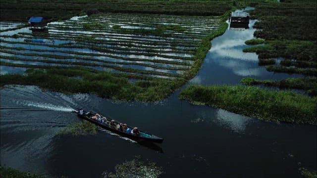 Boat ride towards traditional village on Inle lake