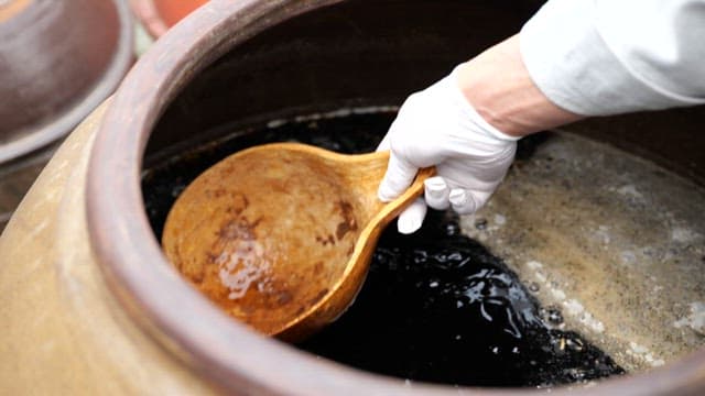Traditional fermented soy sauce filled in a traditional jar