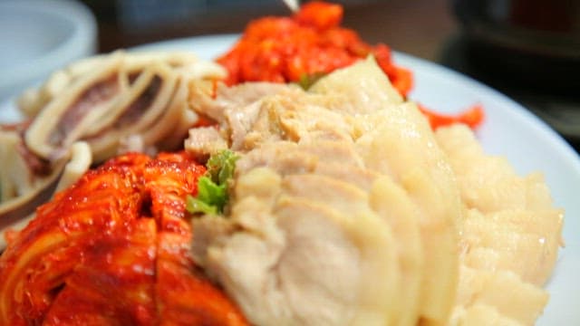 Korean boiled pork and kimchi on a plate