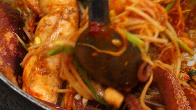 Braised spicy seafood with bean sprouts, abalone, squid, crab, and roe