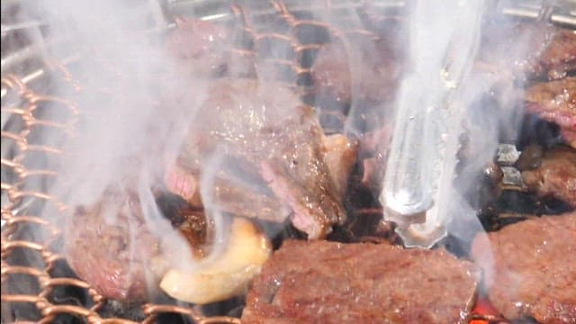 Sizzling beef on a grill