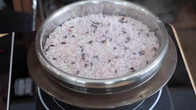 Cooking Black Rice in a Pot on a Stove