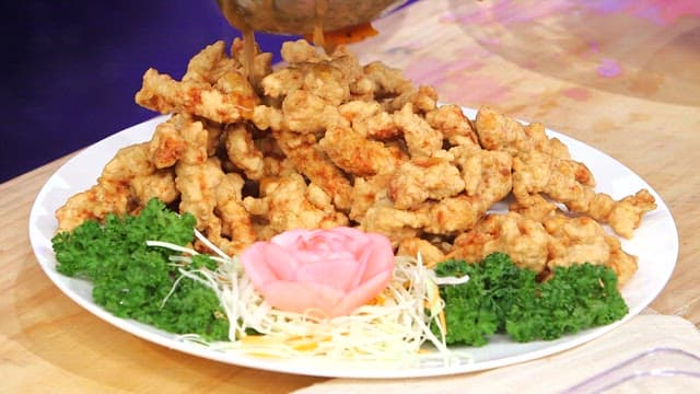 Sweet and sour sauce poured over fried meat
