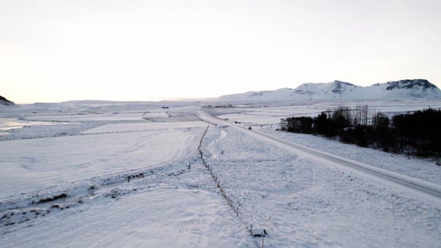 Snowy landscape with distant mountains