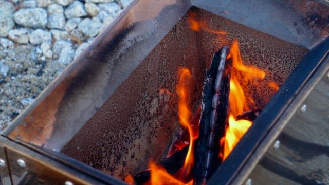 Campfire burning in a portable stove