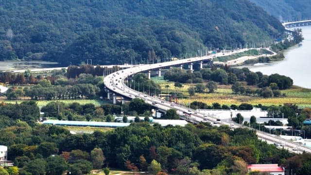 Winding highway through lush greenery