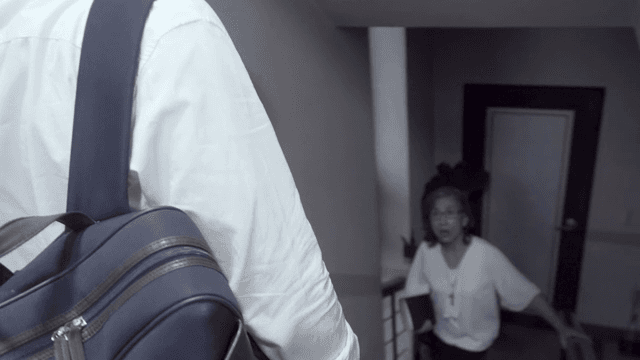 Man meets an old woman while going down the stairs from home