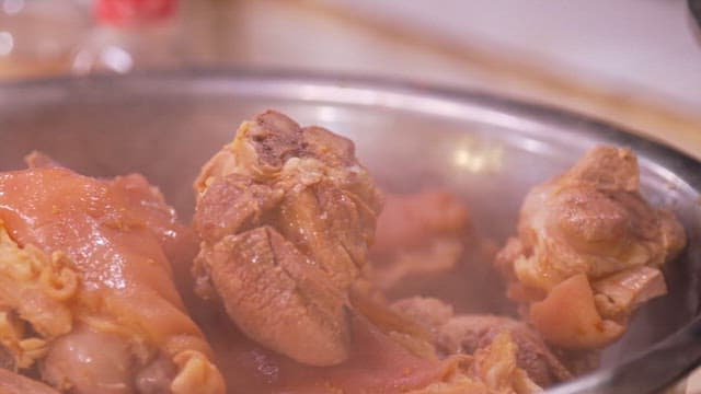 Pig's feet boiling in a pot