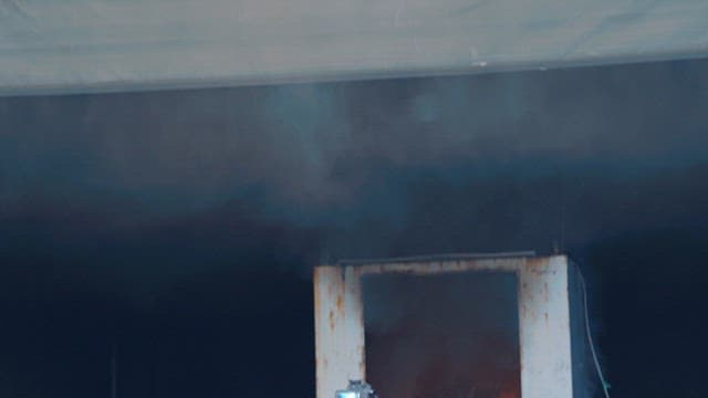 Industrial Doorway Shrouded in Smoke