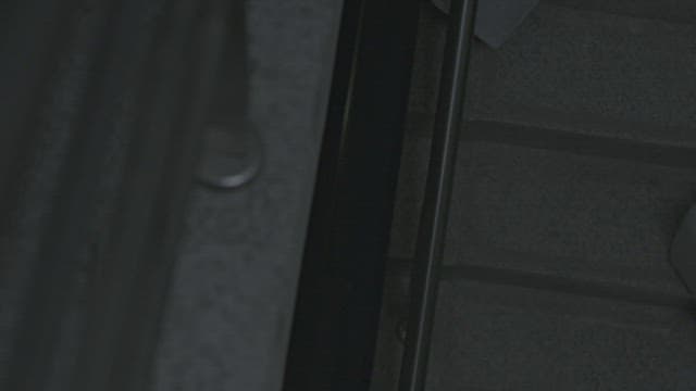 Female student climbing the dark stairs with curiosity