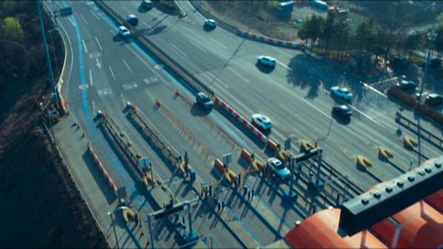 Vehicles Passing Through a Highway Tollgate