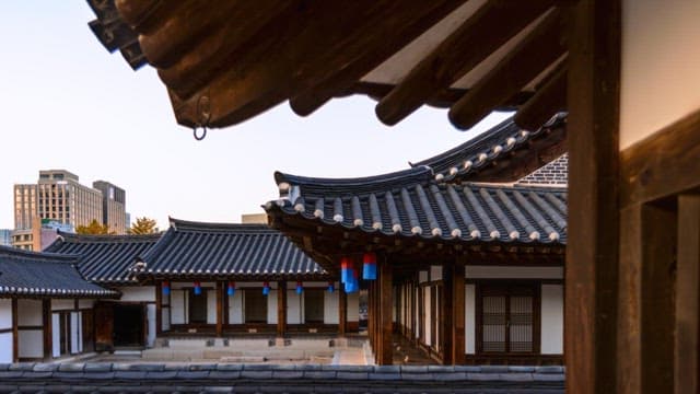Traditional Korean house transitioning from dusk to night