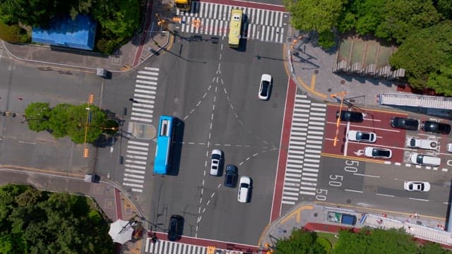 Busy intersection with lots of traffic on a sunny day