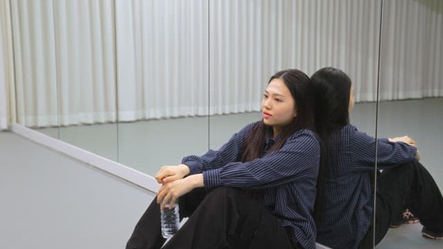 Woman drinking water indoors