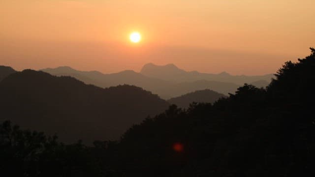 Serene Sunset over a Mountainous Landscape