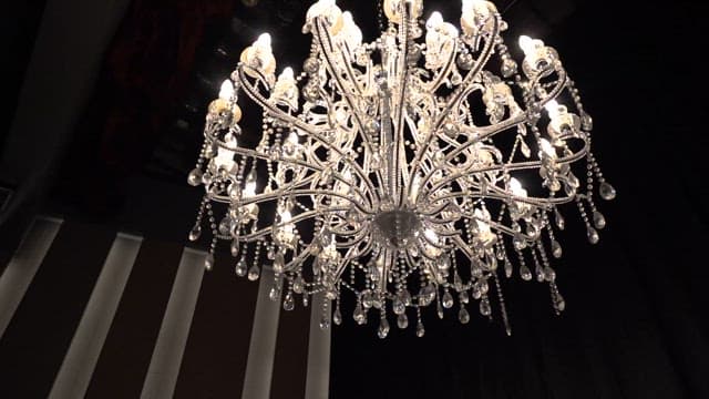 Elegant chandelier illuminating a dark room