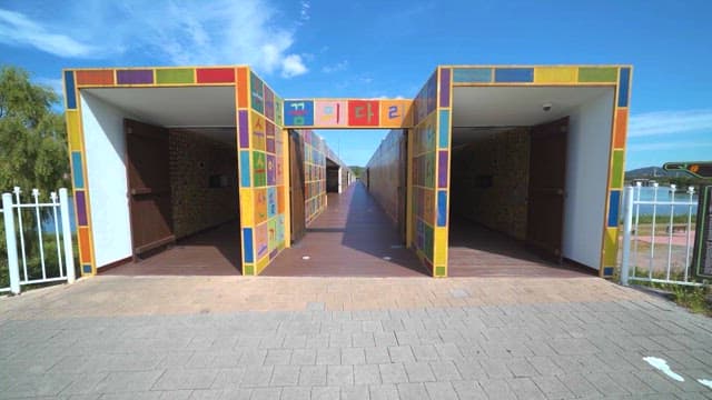 Colorful mural tiles in urban pedestrian passage