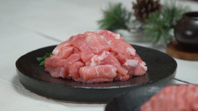 Close-up of chopped meat displayed on black plates