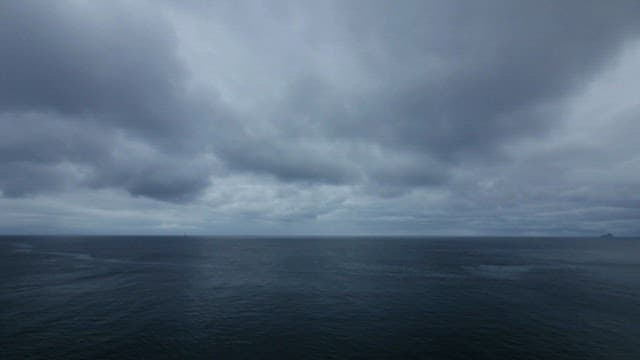 Overcast Sky Over Calm Sea Horizon