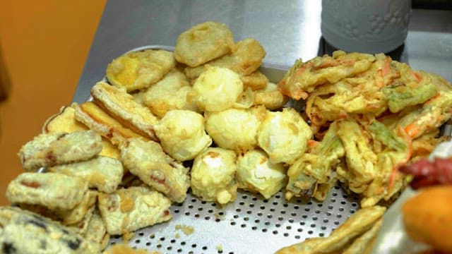 Various fries pre-fried on a tray